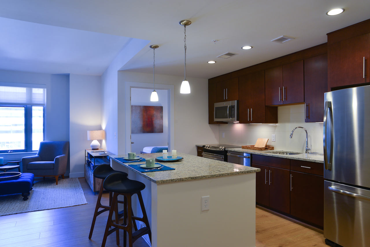 Park Chelsea Apartments in Washington, DC | 2 Bedroom Living Area and Kitchen | Light Color Scheme