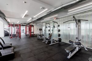 Agora fitness center featuring weights and treadmills